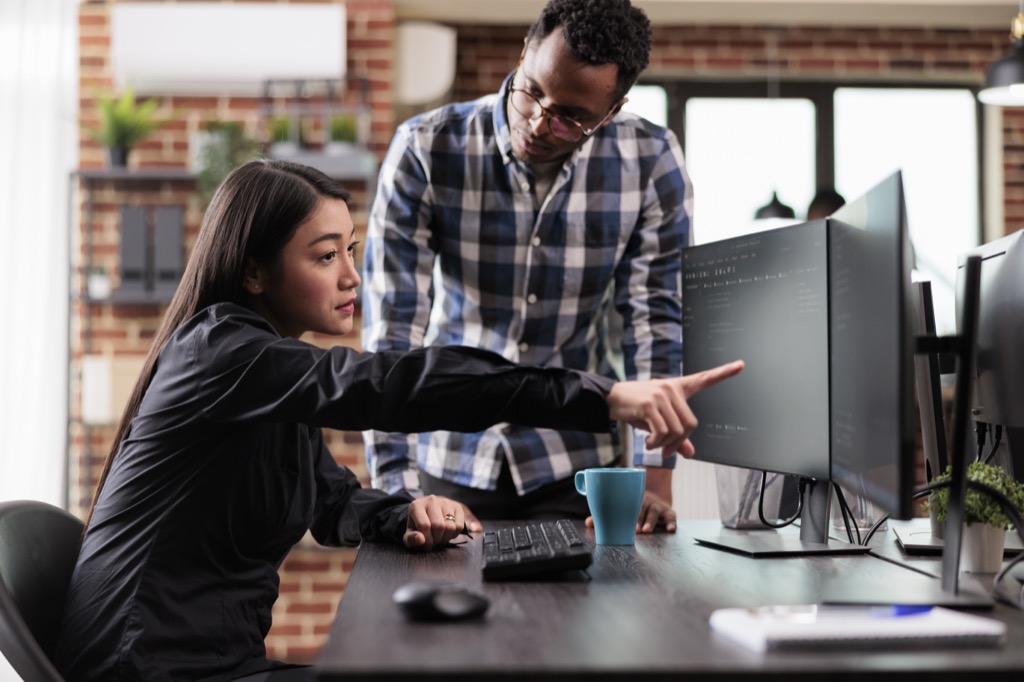 Engineers reviewing a failed test run together to work out the root cause